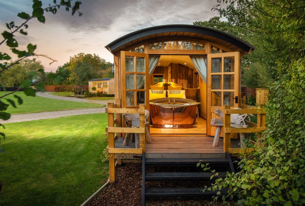 Book Shepherds Hut Spa accommodation at Glampio Gelli Glamping. Best UK  Price Guarantee