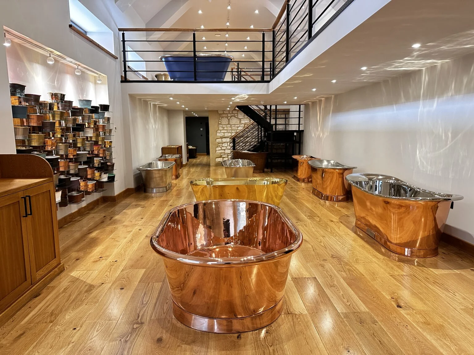 Copper baths and basin displays inside the William Holland Dorset showroom