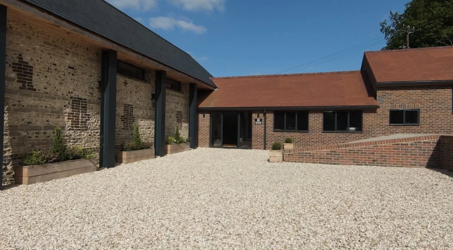 Stone and brick showroom buildings around the Dorset courtyard