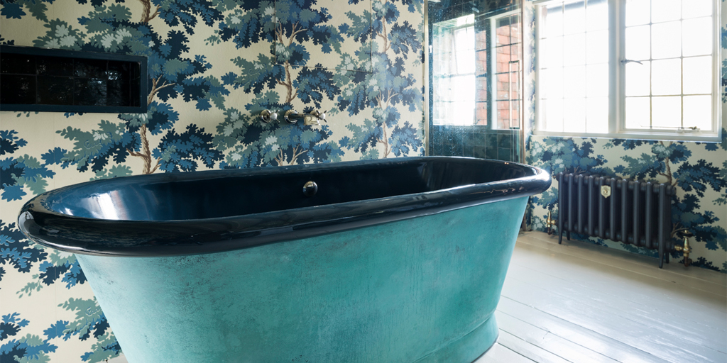 blue enamel bath by William Holland in a bathroom devor