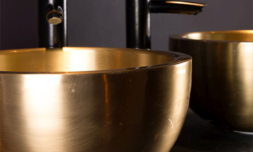 William Holland brass basin in a hotel bathroom set up