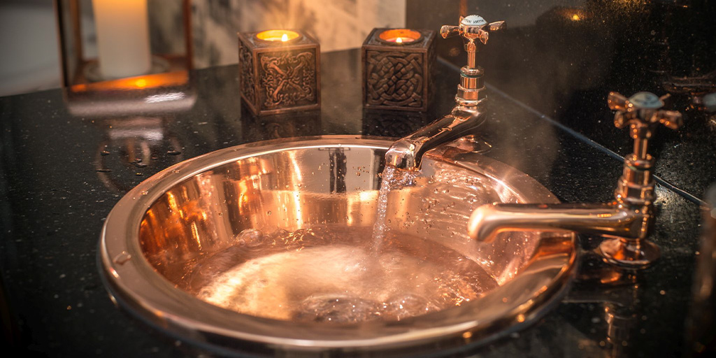 copper basin by William Holland in an elegant bathroom set up