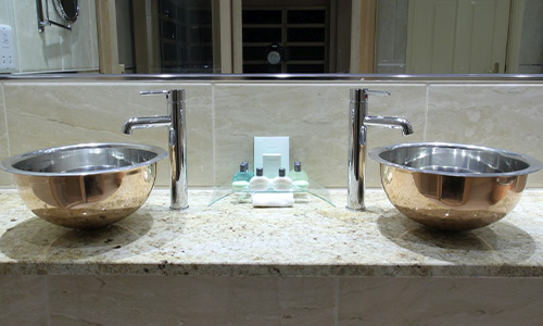 William Holland nickel basin in a bathroom decor