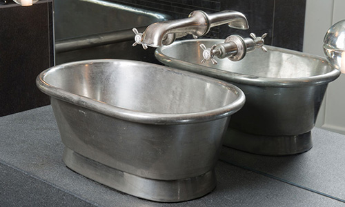 William Holland nickel basin in a hotel bathroom set up