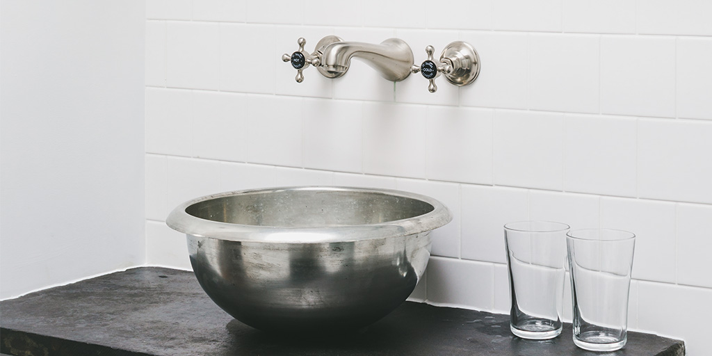 tin basin by William Holland in a luxury bathroom set up